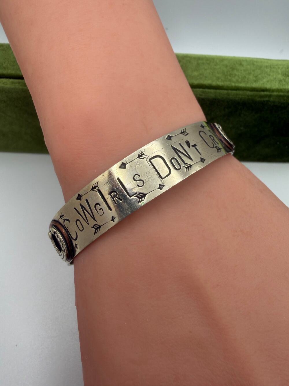 stamped cuff bracelet features the phrase "COWGIRLS DON'T CRY"  by Gypsy cowgirl
